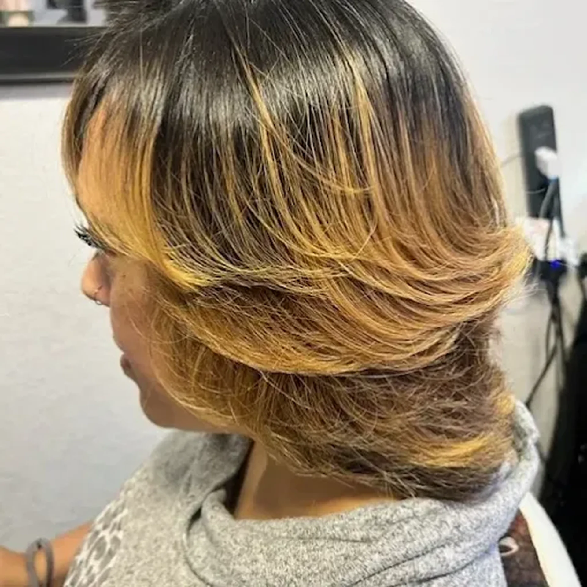 Woman with layered, short ombre hairstyle.